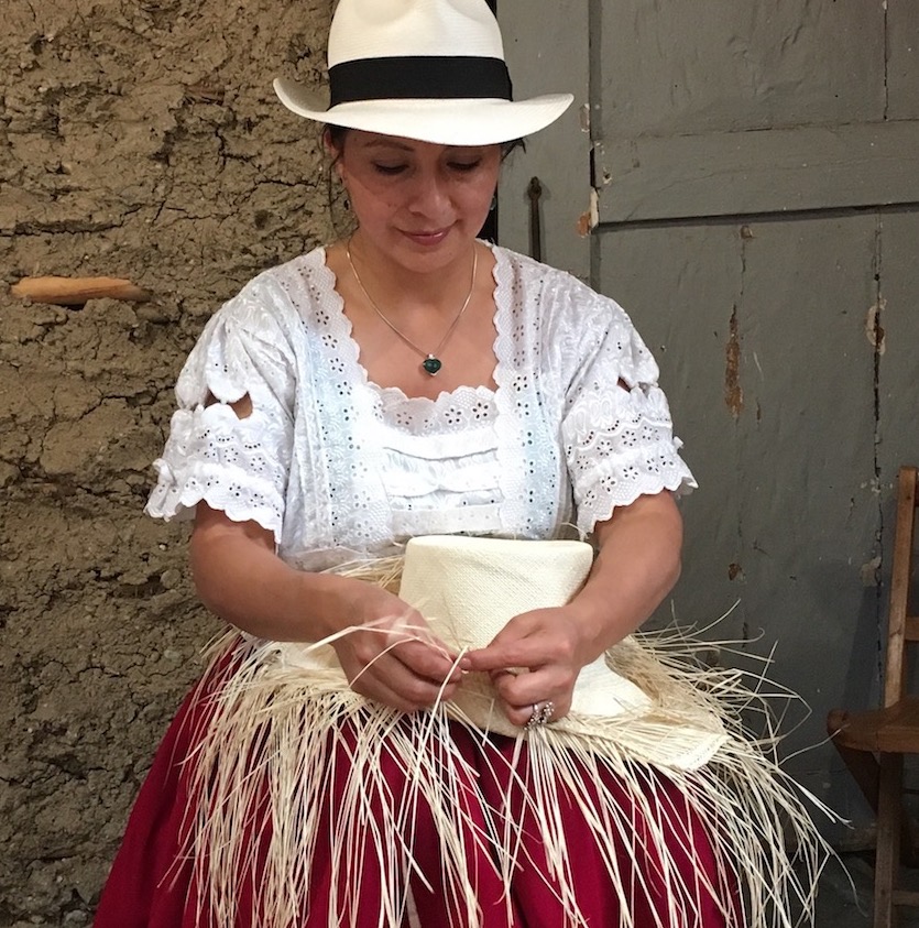 A hat weaver handcrafting a traditional Panama hat in Montecristi, Ecuador.
